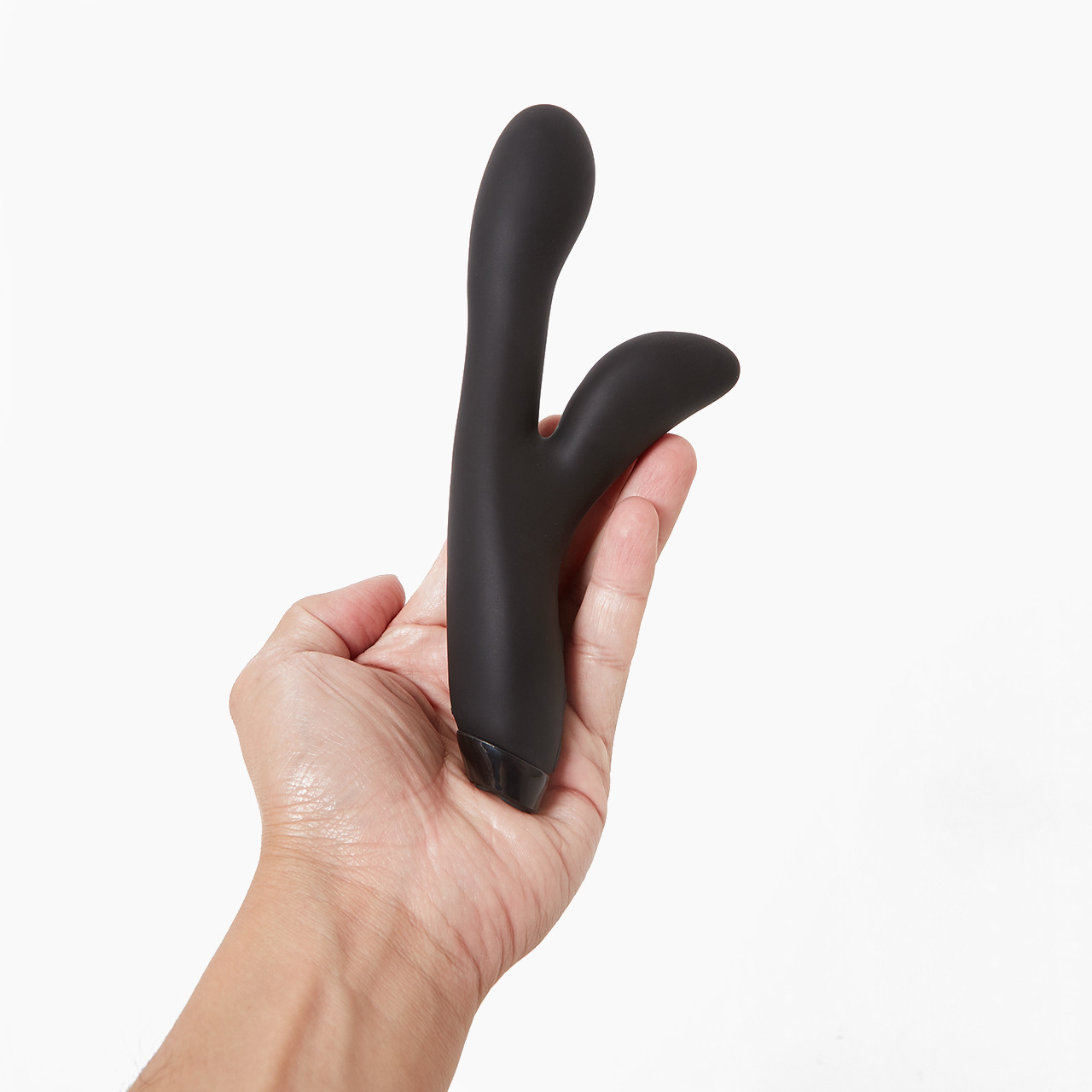 'Je Joue Hera Flex', a black silicone toy with a flexible structure held in a hand