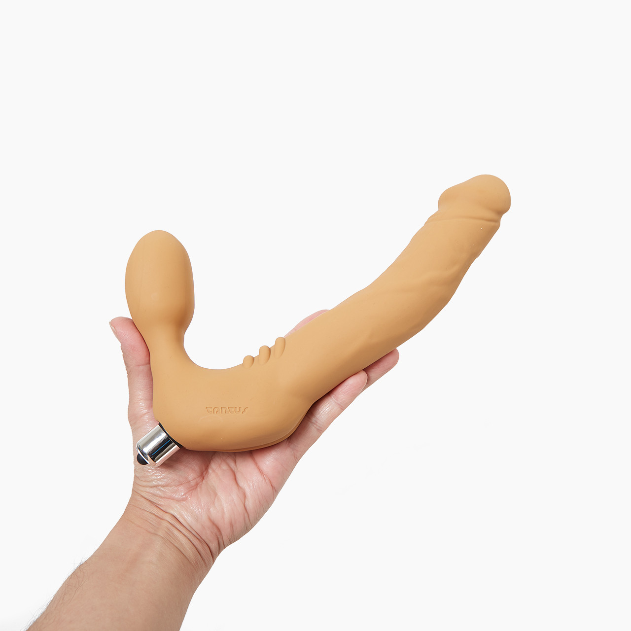 Tantus Real Strapless Strap On held in a hand